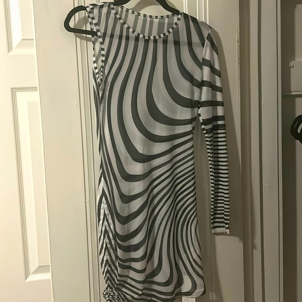 One shoulder zebra print mini dress has two this one is new never worn with tag.